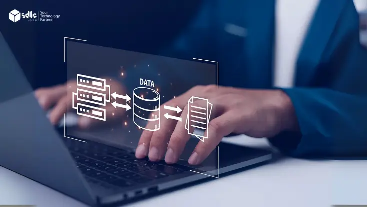Hands typing on a laptop with a digital interface showing data transfer between servers, databases, and documents, representing modern data infrastructure