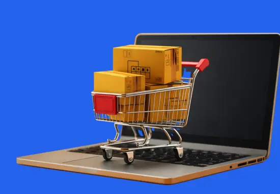 Laptop with a shopping cart and boxes, representing retail eCommerce software development and online retail operations.