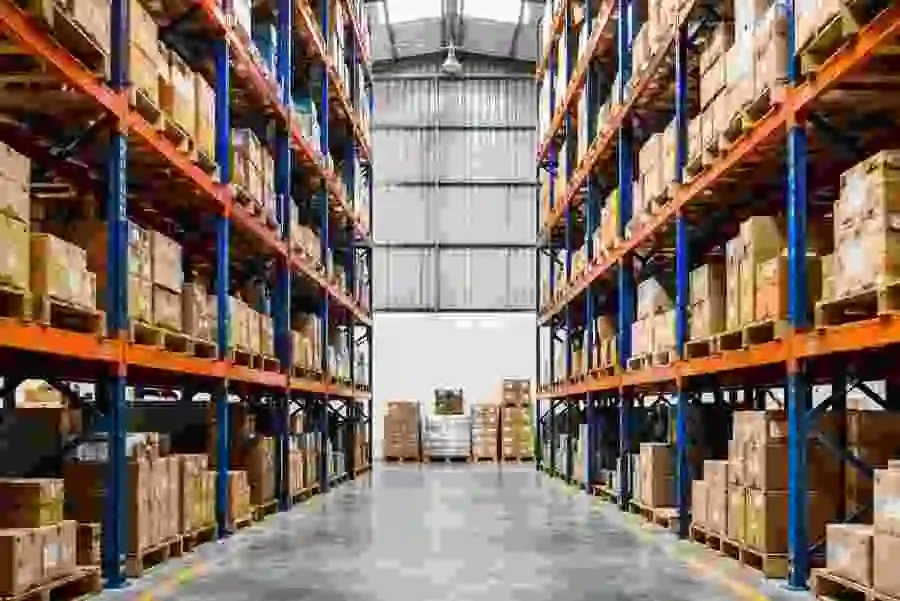 Wholesale distribution warehouse with stacked pallets and shelving