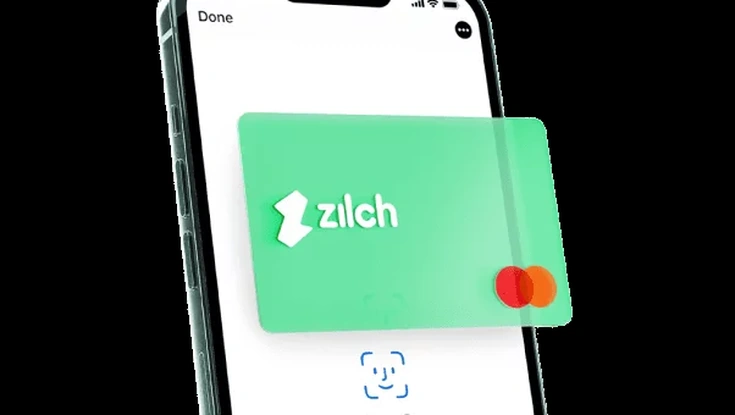 Zilch virtual payment card displayed on a smartphone with Face ID authentication for secure mobile payments.